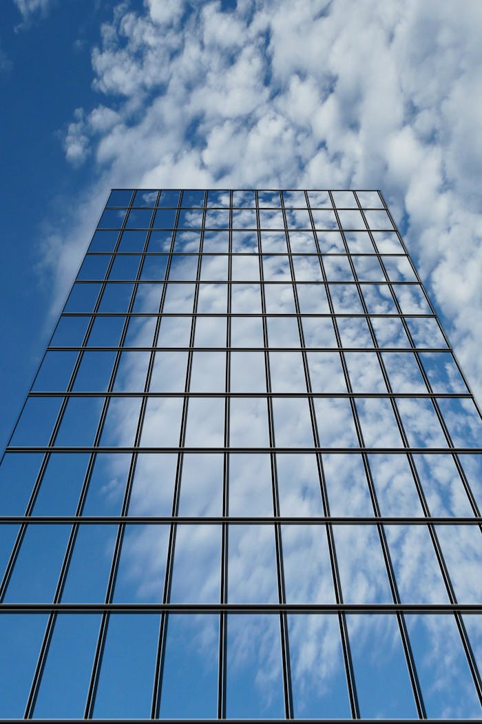 Glass curtain wall facade viewed from below